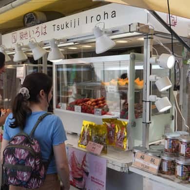 A Tsukiji Outer Market shopfront with its awning out and its counter stocked