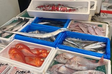 Blue crates of bream, snapper and mackerel packed on ice at the market