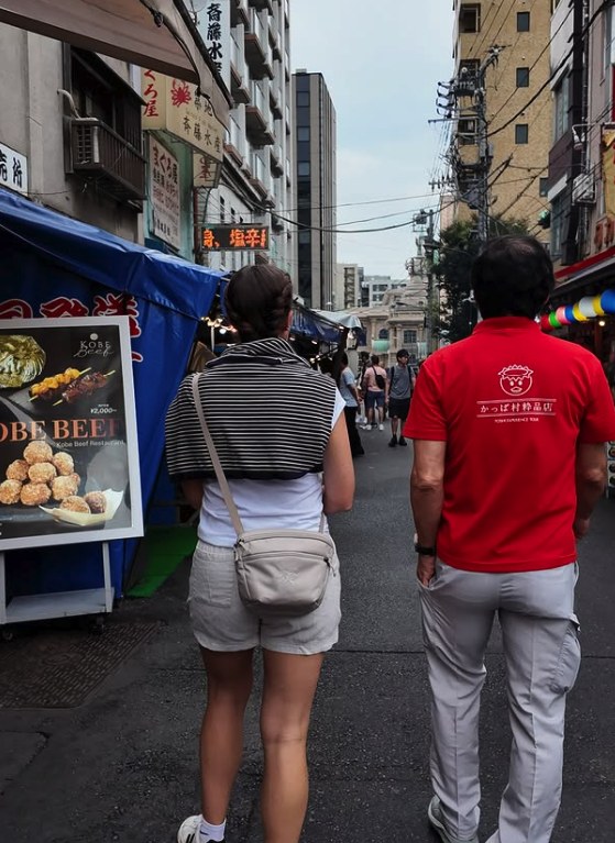 Walking one of the covered lanes of the Tsukiji Outer Market behind a guide